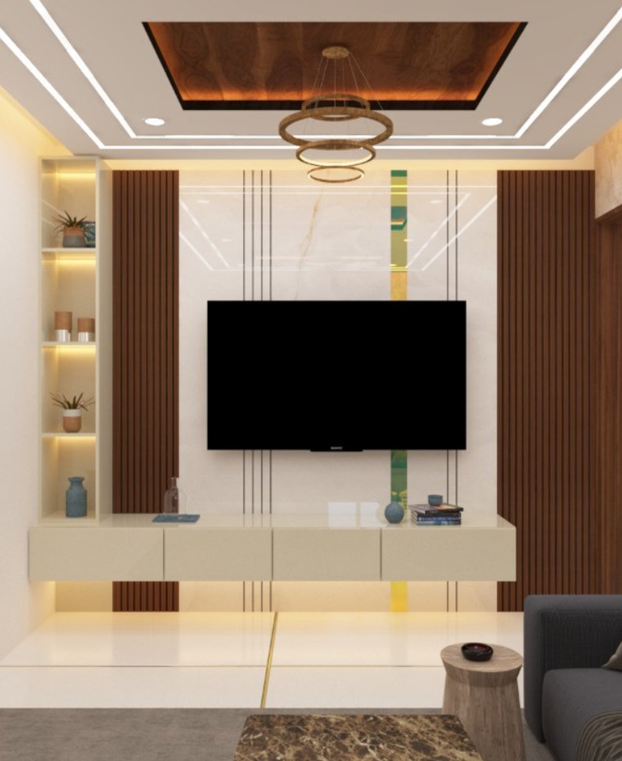 Living room TV unit with fluted wood panelling, lit display niche and ring chandelier by Homz Space Interiors