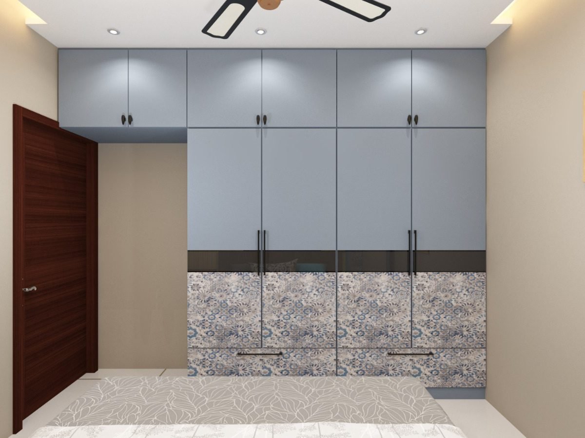 Blue grey wardrobe with four shutters and printed decorative base panels