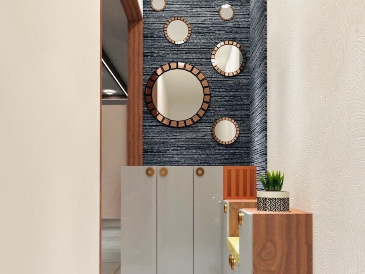 Dressing unit with cluster of round mirrors on a dark textured wall