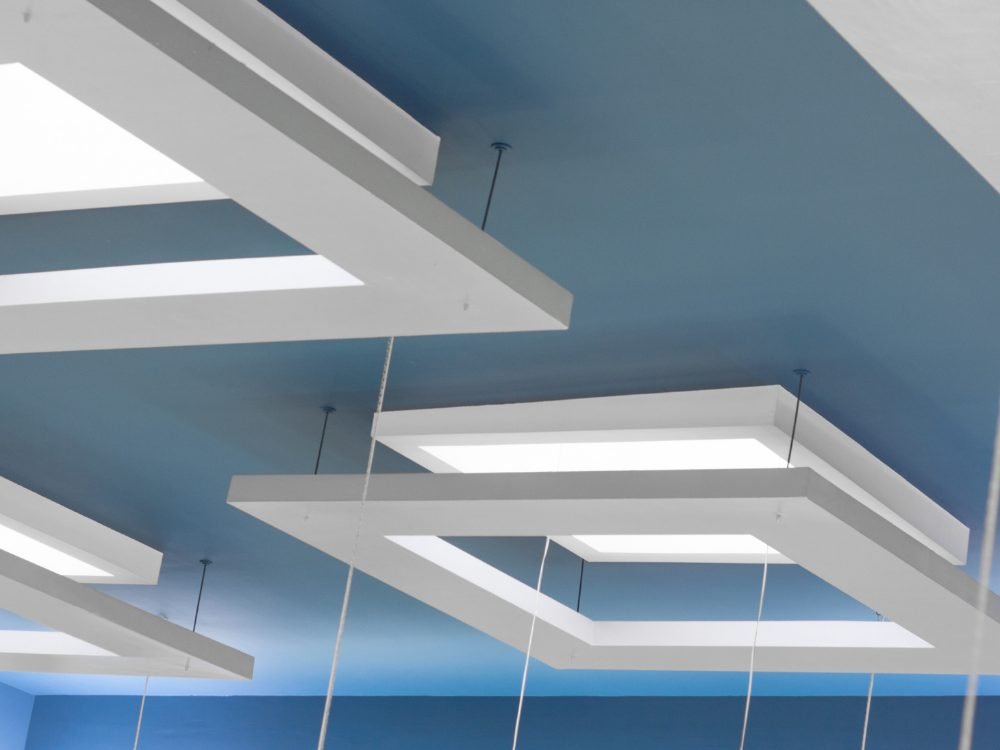 Layered gypsum false ceiling with recessed cove lighting